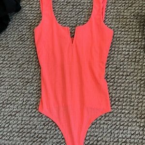 Neon peach/pink body suit